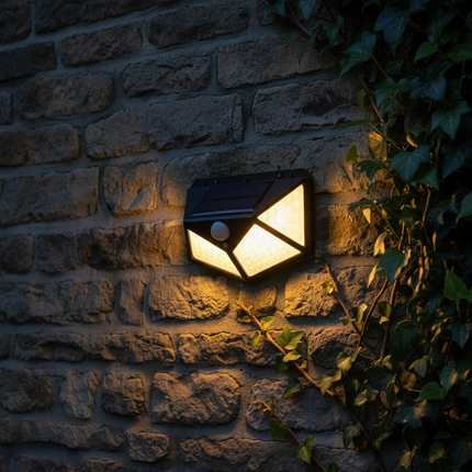 Close-up of solar light on stone wall