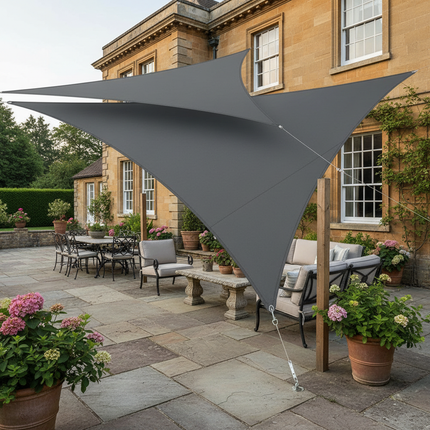 Deep gray triangle shade sail over country house